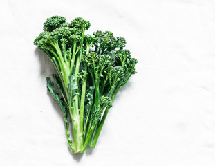 Bunch of fresh flowers broccoli cabbage on a light background top view