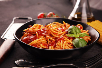 Plate of delicious spaghetti Bolognaise or Bolognese with savory minced beef and tomato sauce garnished with parmesan