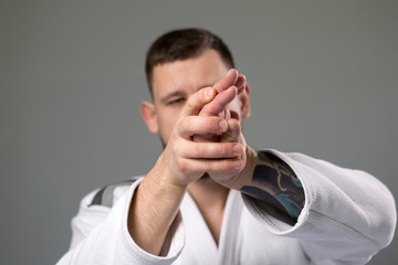 Two caucasian men are practicing aikido on the tatami