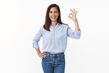 Cheerful confident adult 30s woman with tattooed arm see no problem, motivated deal task, smiling assertive, assure everything okay good, stand satisfied, approve excellent choice, white background