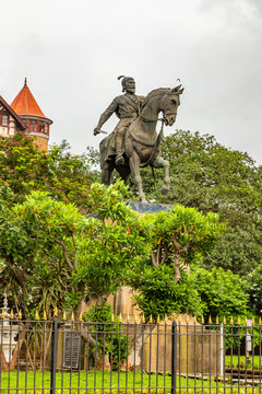 Statue of King Shivaji,Statue of Chhatrapati Shivaji Maharaj in Mumbai Opp Gateway of India , Maharashtra, India with the monsoon clouds in background.