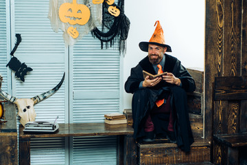 Halloween decoration and scary concept. Magic hat. Happy Halloween Weekends. Magic book.