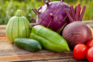 vegetables on a wooden table outside