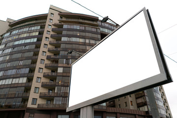 billboard standing in the city, with white field.