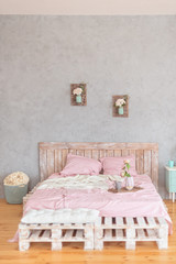 Fototapeta na wymiar Tray with a romantic breakfast and rose in the bedroom in pastel colors