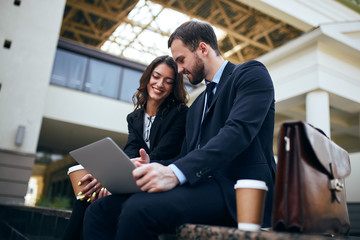 two office people having fun in the street, close up side view .leisure concept