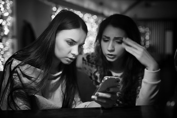 The girl in the evening in a cafe