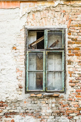 Fototapeta na wymiar The old dilapidated wooden window frame