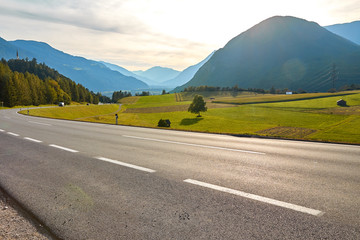 Mountain road in Germany, between green fields and mountain landscapes
