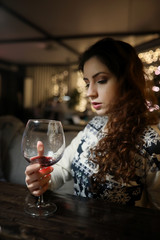 The girl in the evening rest in a cafe