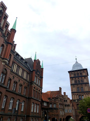 Obraz premium Old buildings on street, City Lubeck, Ancient Germany, background