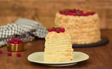 Slice Confectionery Napoleon Cake decorated with raspberry. Portion of Custard Cream Cake.