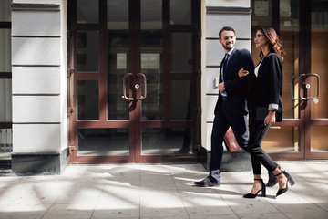 Obraz premium family business, young couple starts business, full length side view photo.man and woman rushing to the aim