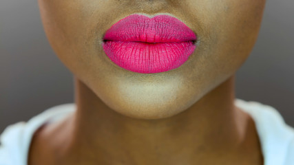 Pretty black woman, pink matte lipstick