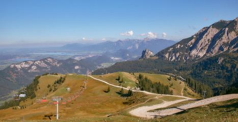 Mountain landscape in Austria, cloudy, forests, rocks, city in the mountains, summer