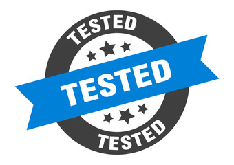 tested sign. tested blue-black round ribbon sticker