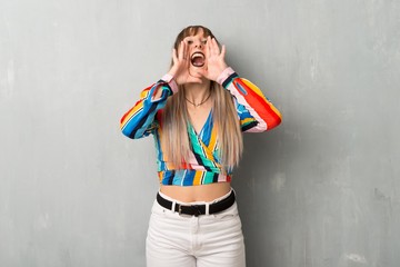 Young  girl with colorful clothes shouting and announcing something