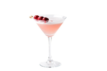Pink cocktail with champagne and cocktail cherries in martini glass over white background