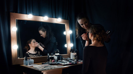 Beautician applying makeup