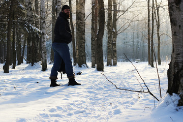 Winter forest man footpath