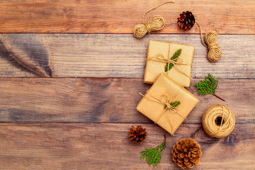 Fototapeta premium Christmas craft accessories on brown wooden background. Copy space