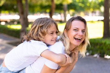 Happy mother and son in a park
