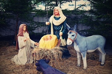 Beautiful nativity scene with baby Jesus. Traditional Christmas background of Christian holidays.