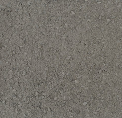 Vue macro d'une texture de sable gris avec gravillons