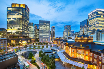 Tokyo city skyline at railway station surround by modern highrise building at twilight time.  Tokyo city, Japan.
