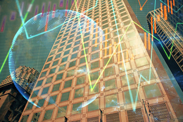 Forex chart on cityscape with tall buildings background multi exposure. Financial research concept.