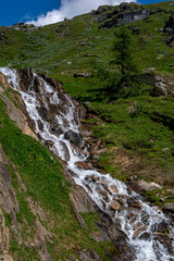 Fototapeta na wymiar Landscape view of a mountain river in the Alps. GrossVenediger, Summer in The Alps, Austria.