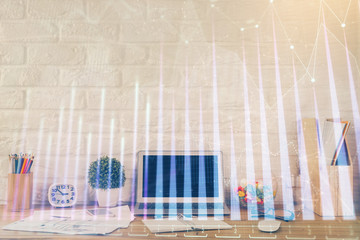 Forex market graph hologram and personal computer on background. Double exposure. Concept of investment.