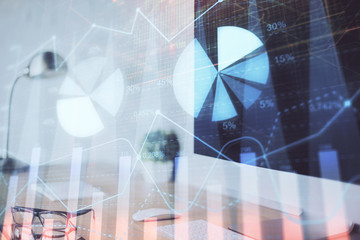 Forex graph hologram on table with computer background. Multi exposure. Concept of financial markets.