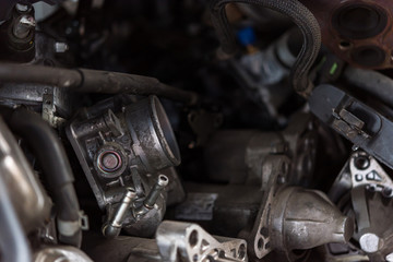 Fototapeta na wymiar Disassembled car dirty engine cylinder at garage