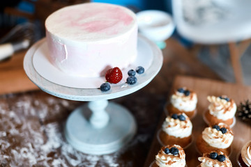 yummy pink biscuit and berries on the plate. close up photo,
