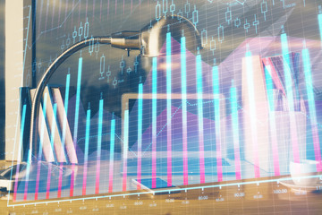 Financial graph colorful drawing and table with computer on background. Multi exposure. Concept of international markets.