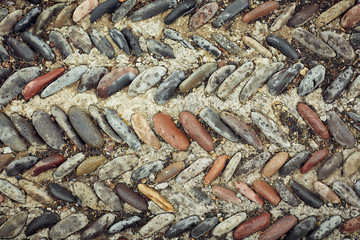 background of fine river stone, pavement lined with stone