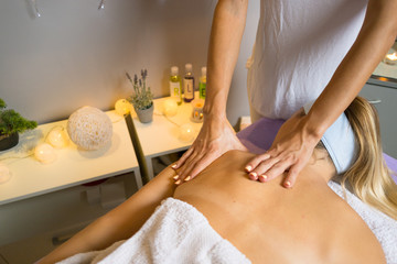 Obraz na płótnie Canvas Female relaxing back massage with hands. Beauty body skin care treatment concept.