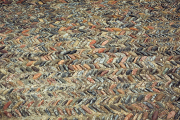 background of fine river stone, pavement lined with stone