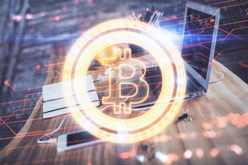 Double exposure of blockchain and crypto economy theme hologram and table with computer background. Concept of bitcoin cryptocurrency.