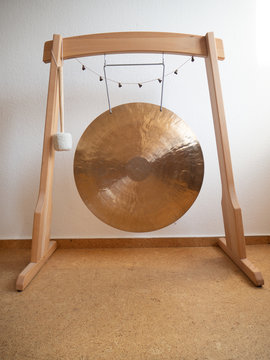 Golden Gong in a wooden stand