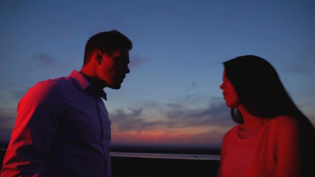 Girl breaking up with boyfriend at evening terrace, leaving him alone, relations