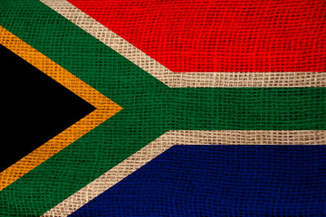 photo of the beautiful colored national flag of the state of South Africa on textured fabric, concept of tourism, economy and politics, closeup