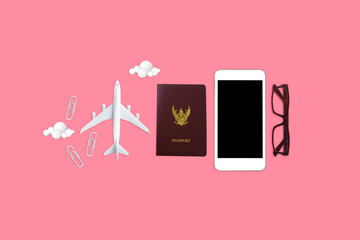  flat lay travel on pink background