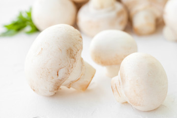 Fototapeta na wymiar Champignon mushrooms with herbs on white background. 