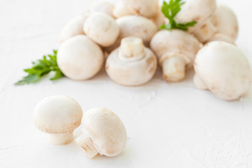 Fototapeta na wymiar Champignon mushrooms with herbs on white background. 
