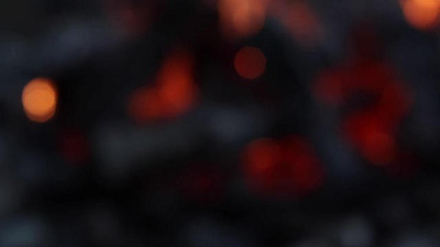 defocus shot to fading fire, close up