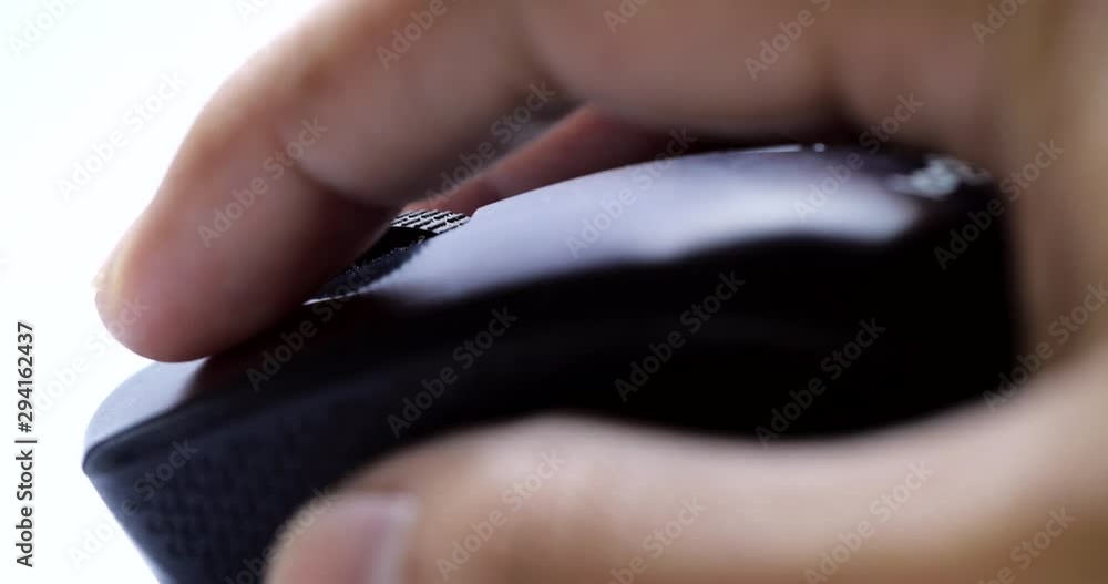 Aufkleber close-up of a businessman hand use black wireless mouse. scrolling the wheel and click wireless mous