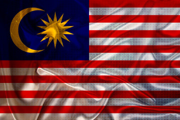 beautiful photo of the national flag of Malaysia on delicate shiny silk with soft draperies, the concept of state power, country life, horizontal, close-up, copy space