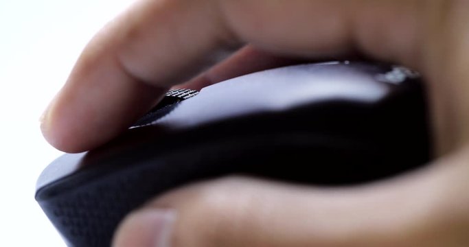 Close-up of a Businessman hand use black wireless mouse. scrolling the wheel and click wireless mouse - 4K
